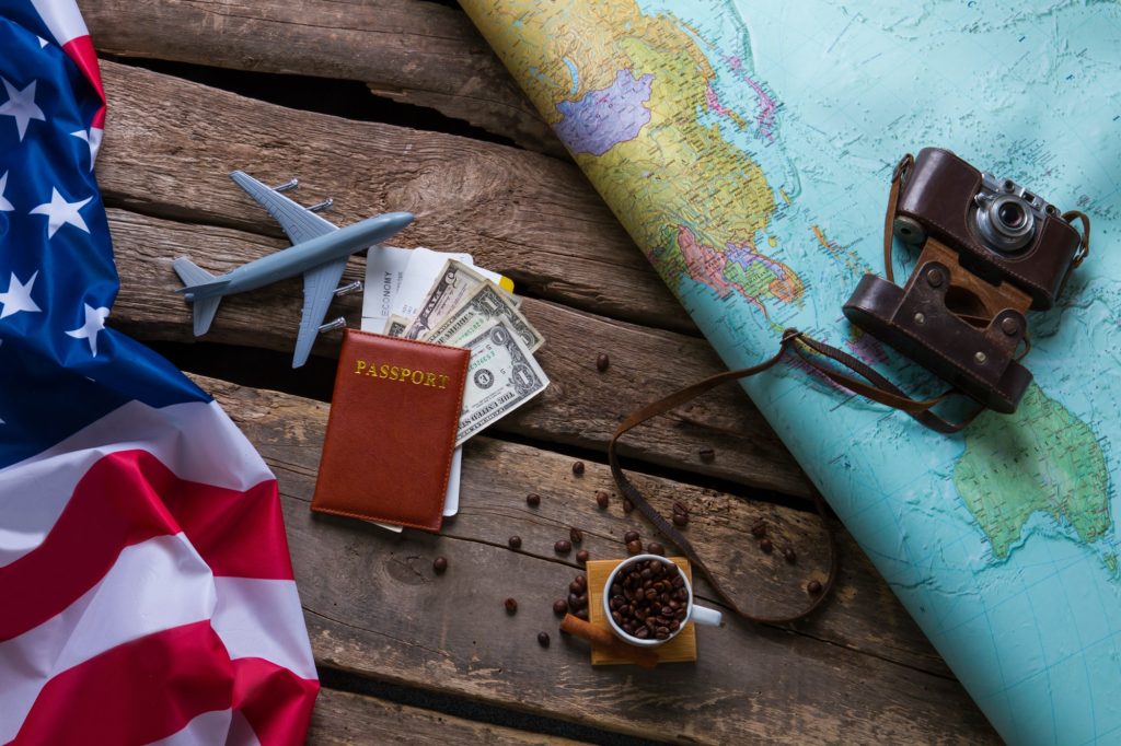 Brown passport and US flag