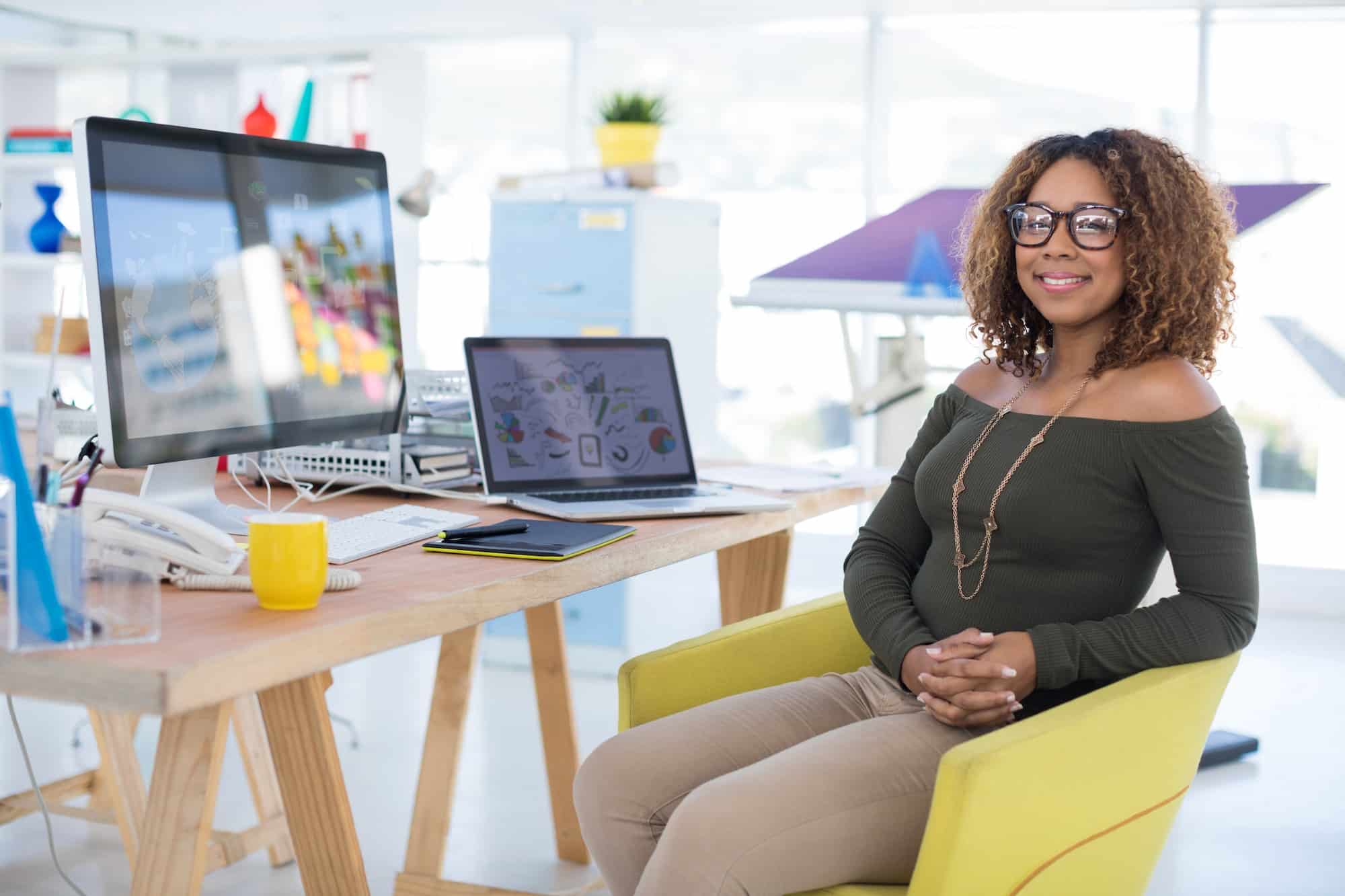 Female graphic designer working at desk